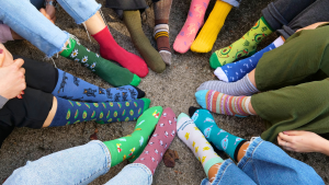 Lots of bright multicolored socks forming a circle.